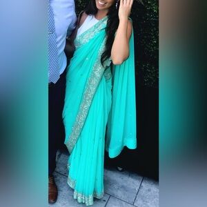 Elegant Turquoise Sari with Silver Accents